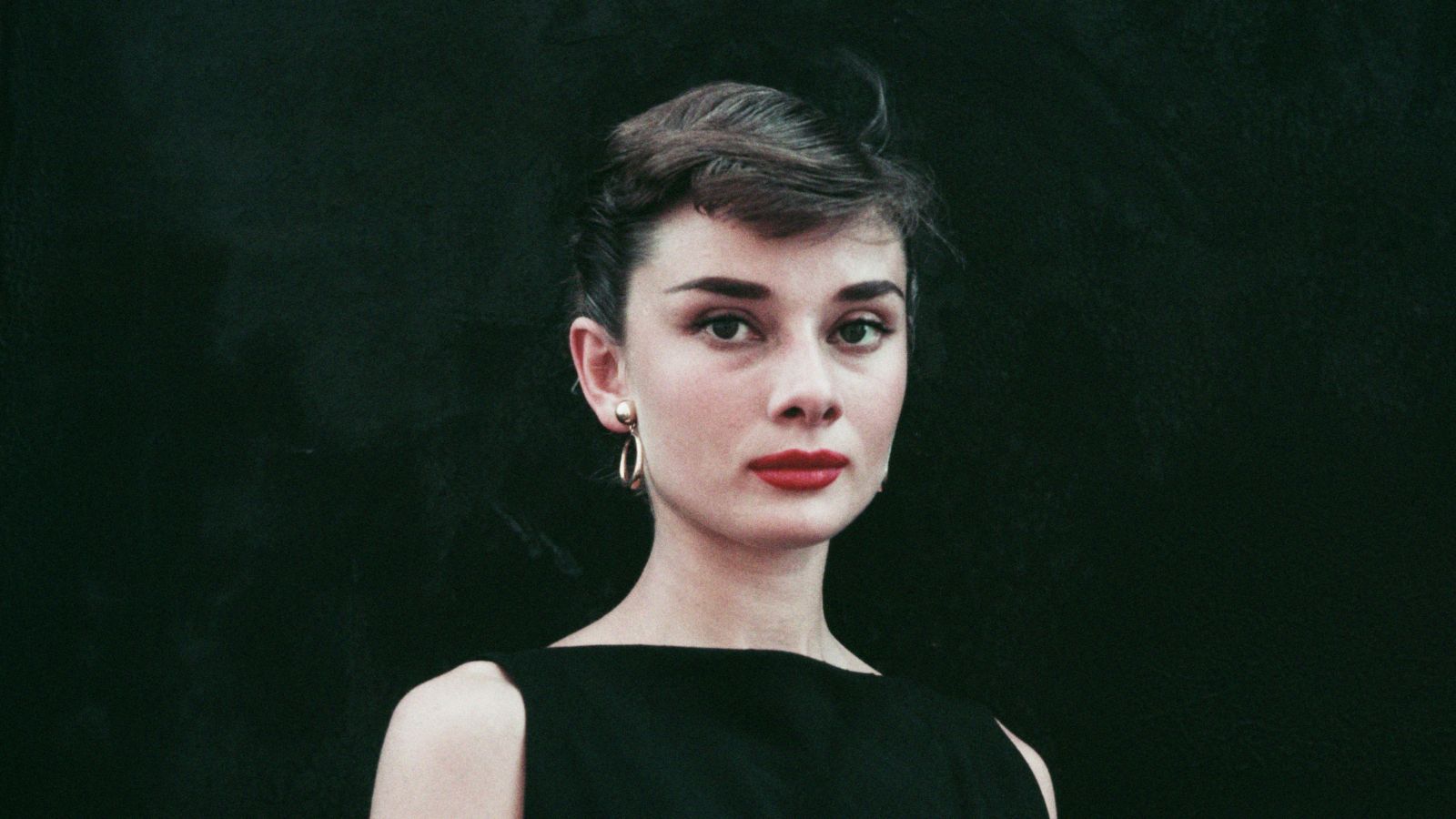audrey hepburn on a black background