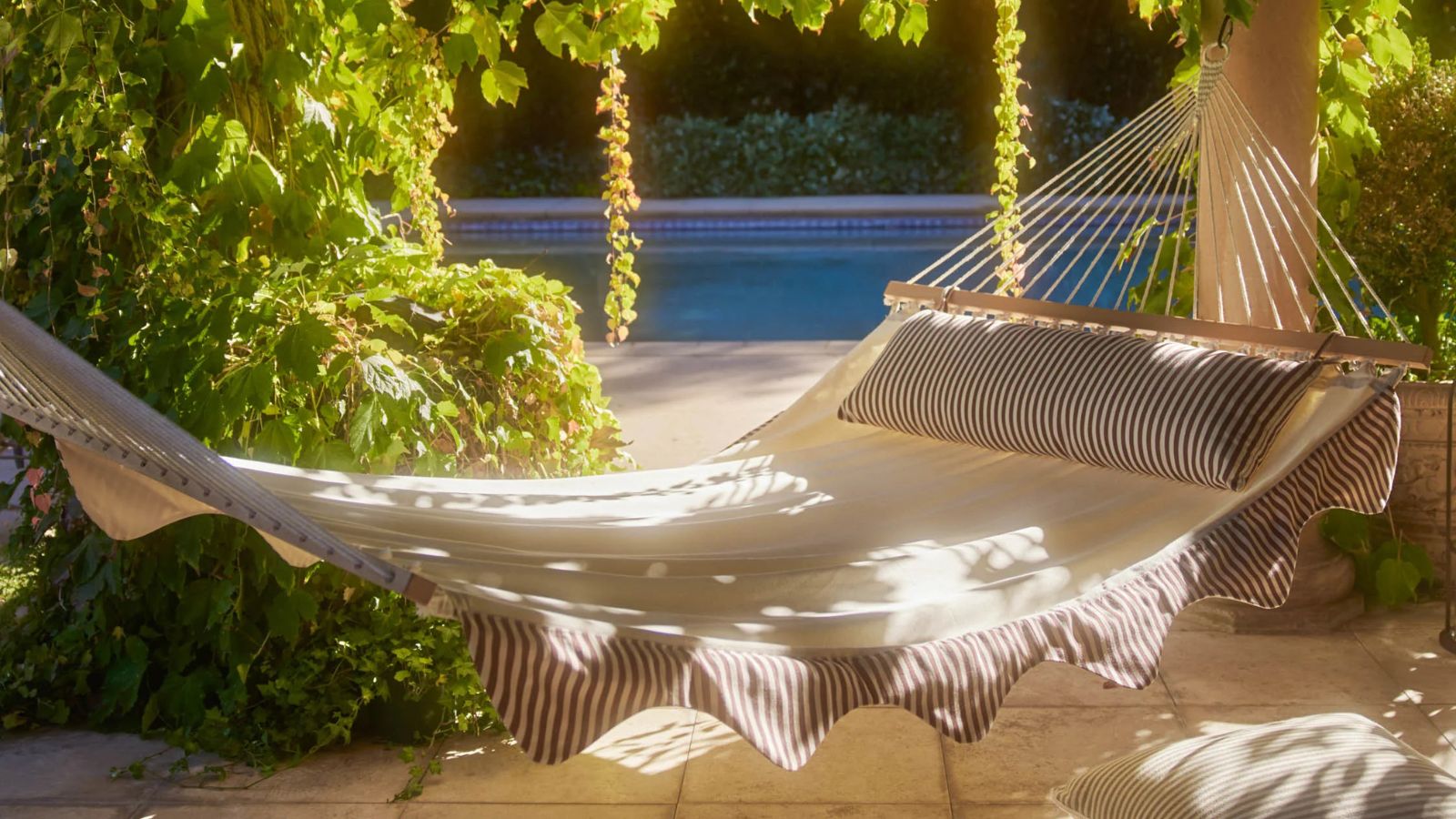 Lulu and Georgia hammock with striped scalloped edges and matching pillow