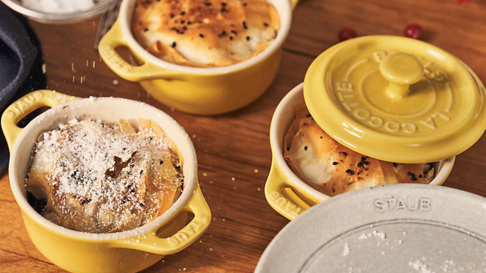 Staub ceramic cocottes in Citron, holding individual sweet filo pies
