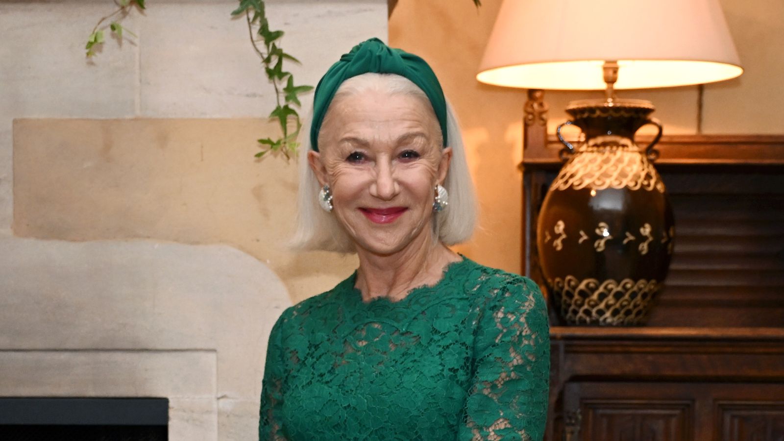 helen mirren in a neutral home background