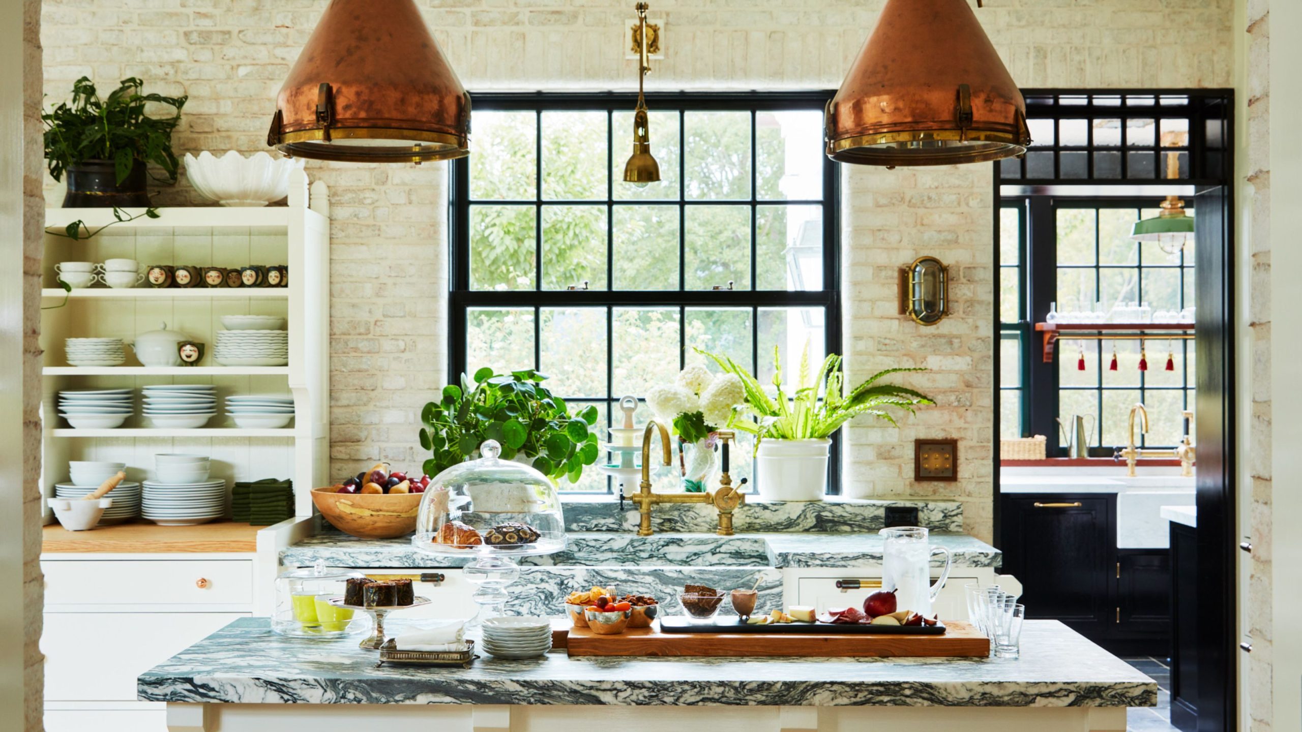 Bryan Graybill's kitchen with copper pendant lights and marble kitchen island