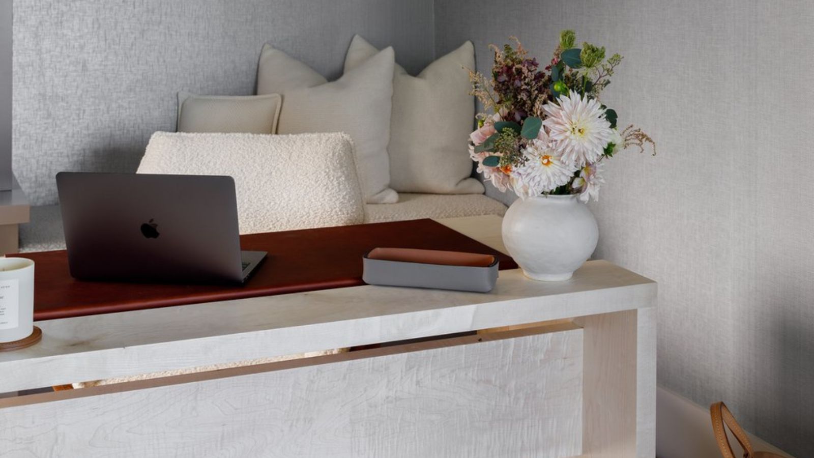 Small cozy home office with bench seating in shot