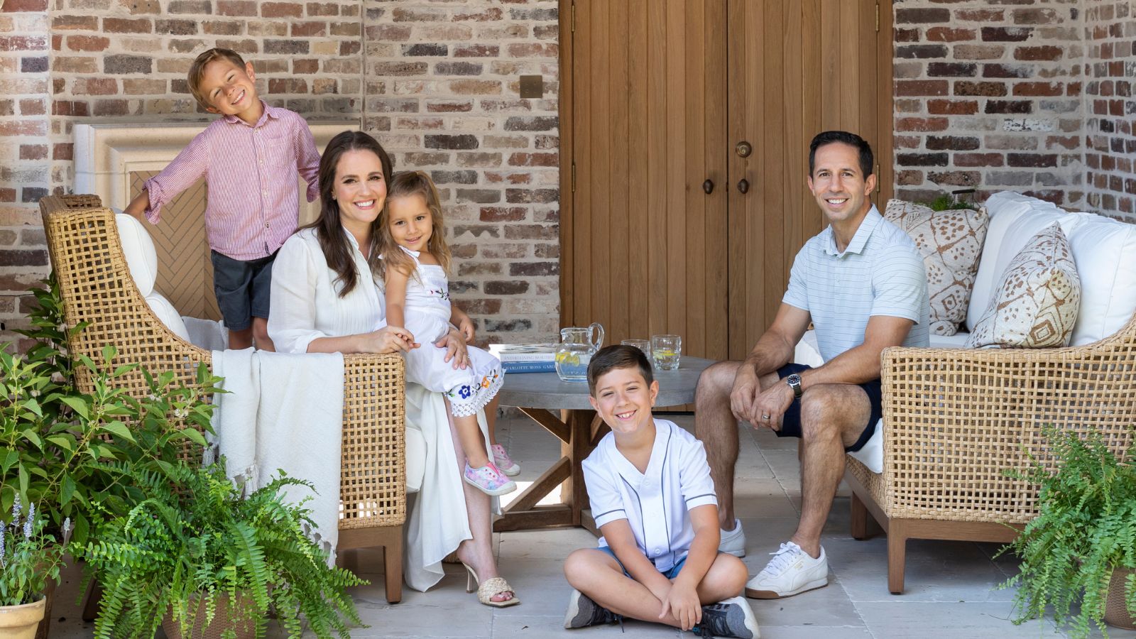 Designer Marie Flanigan and her family on the patio of their home