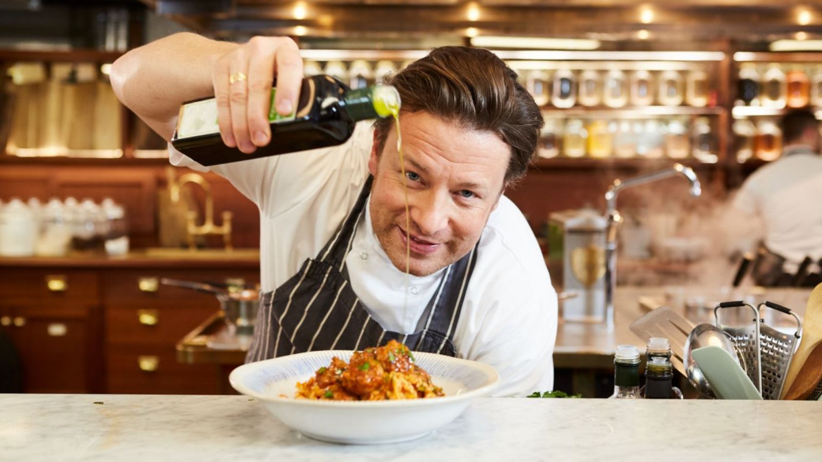 Jamie oliver cooking pasta in his studio