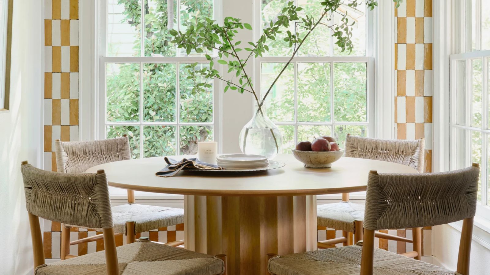 Good Feng Shui in the Magnolia Mini Reni 2.0 breakfast nook, featuring a rustic cream accent bowl filled with fruit on a wood table
