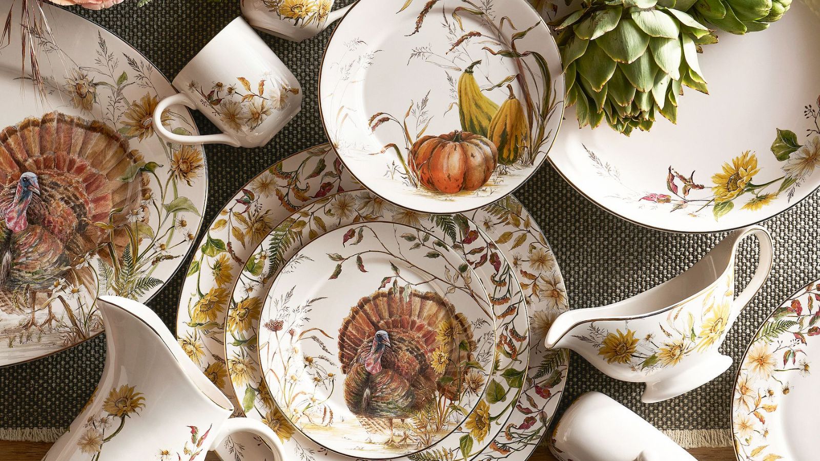 Aerial view of Thanksgiving crockery with harvest motifs and turkey prints