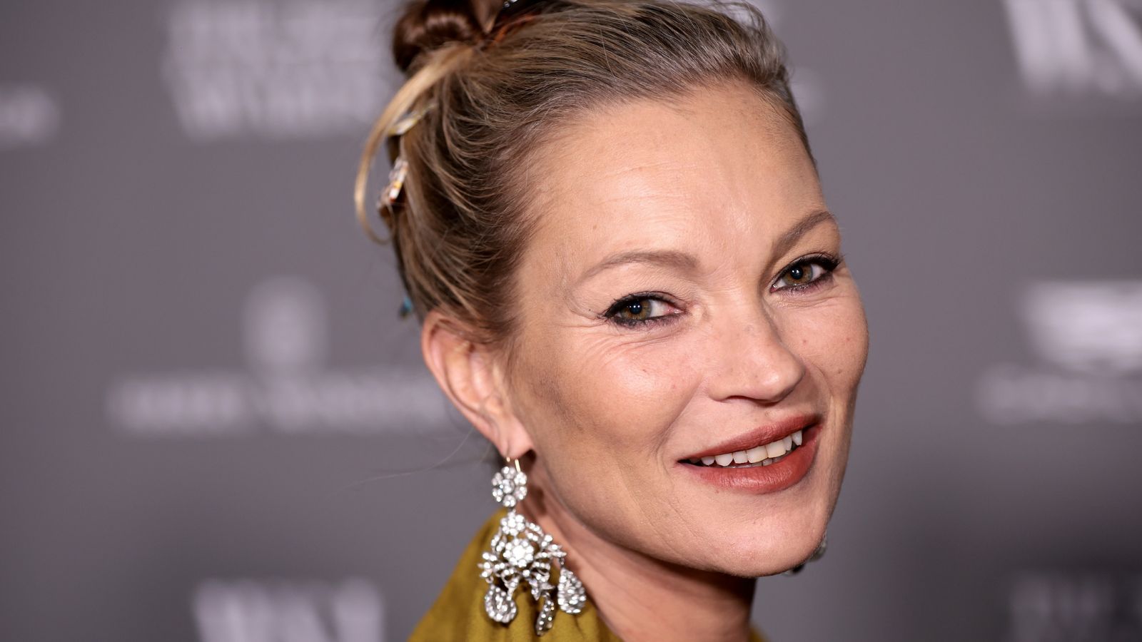 kate moss on a gray background