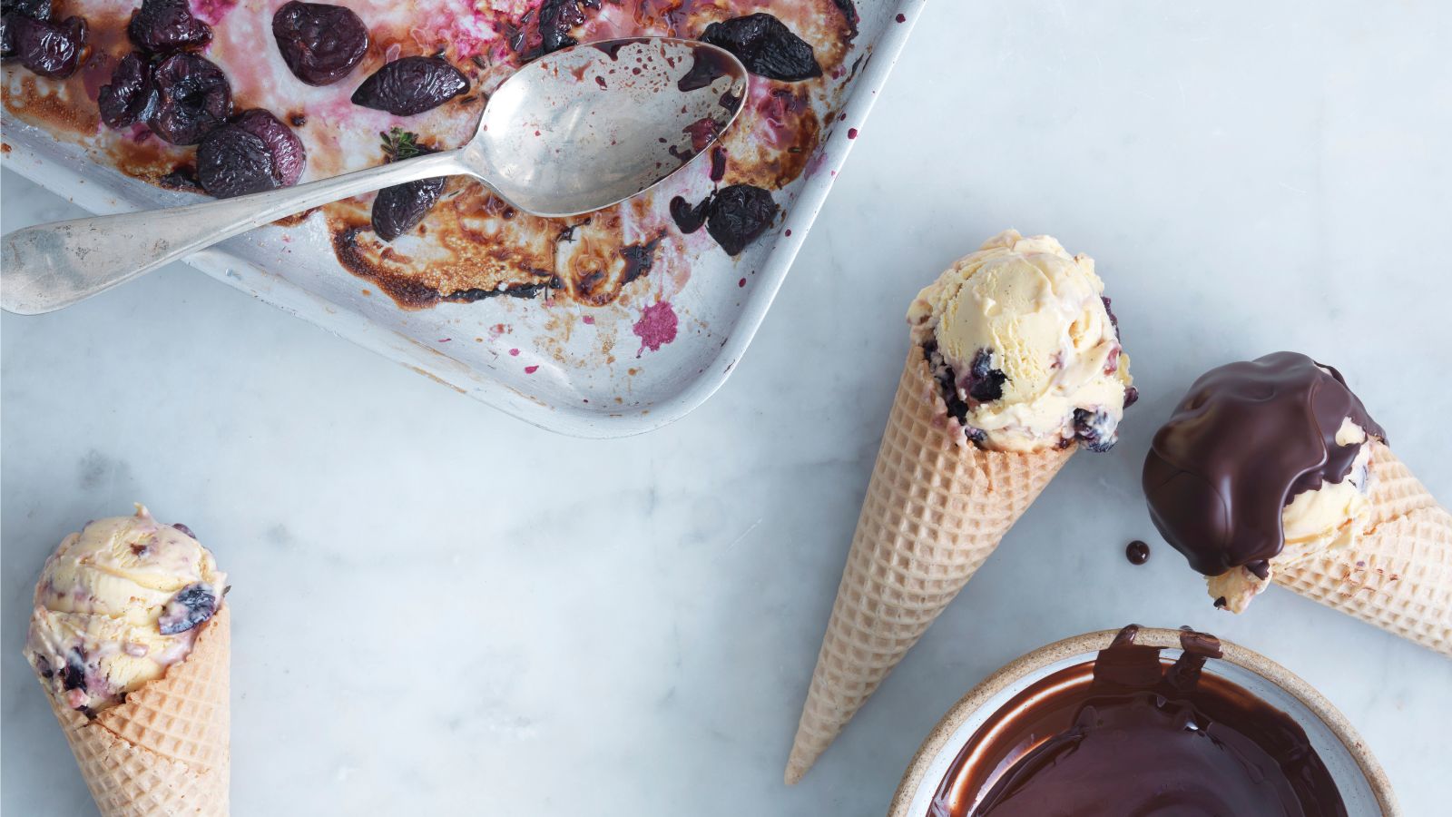Cherry ice cream in cones dipped in chocolate