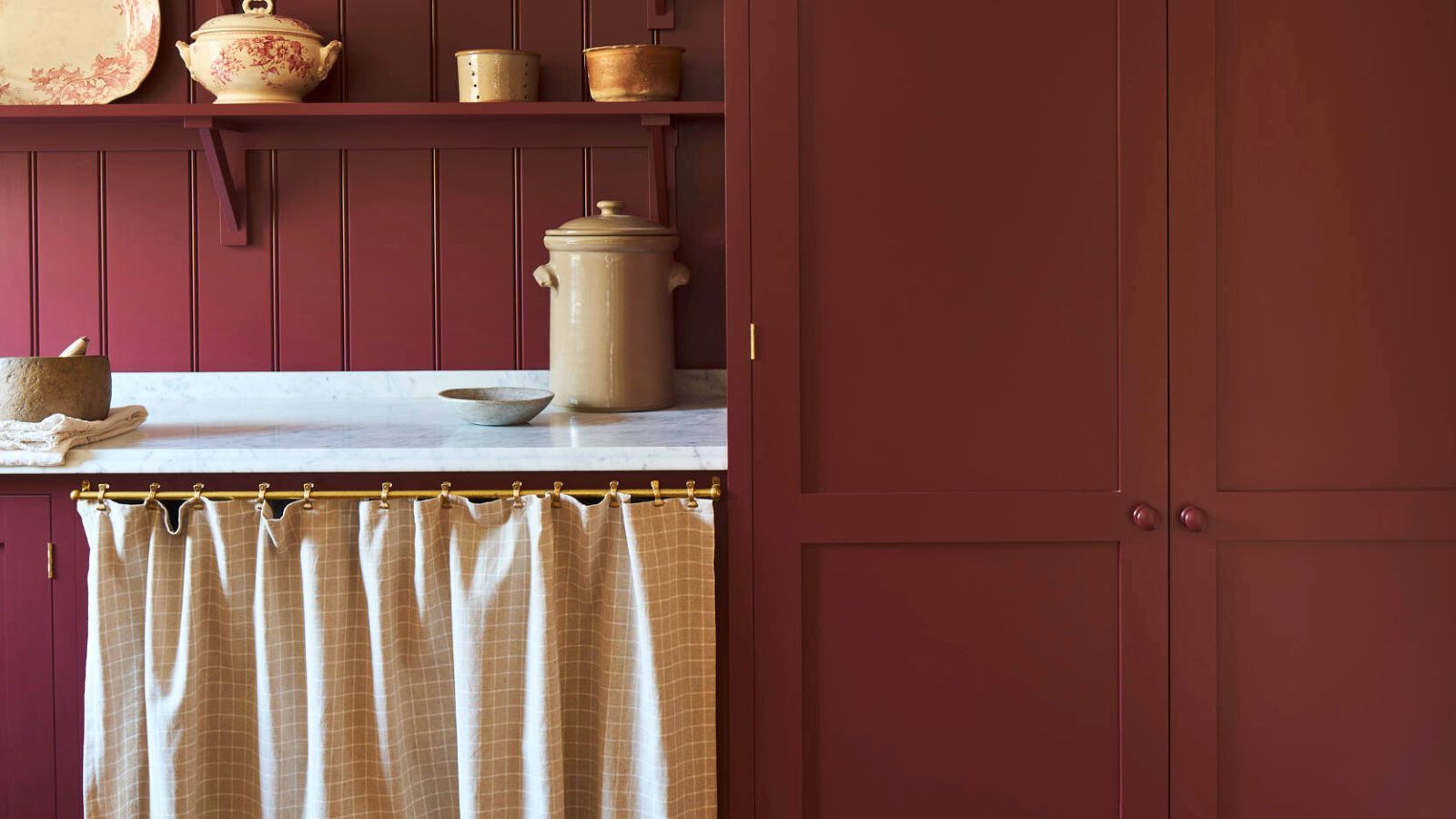 Dark red Laundry room with cottage curtain cubby