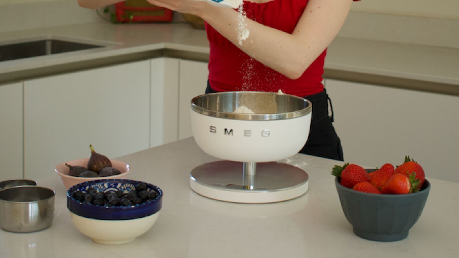 Smeg weighing scales in the test kitchen, surrounded by bowls of fruit