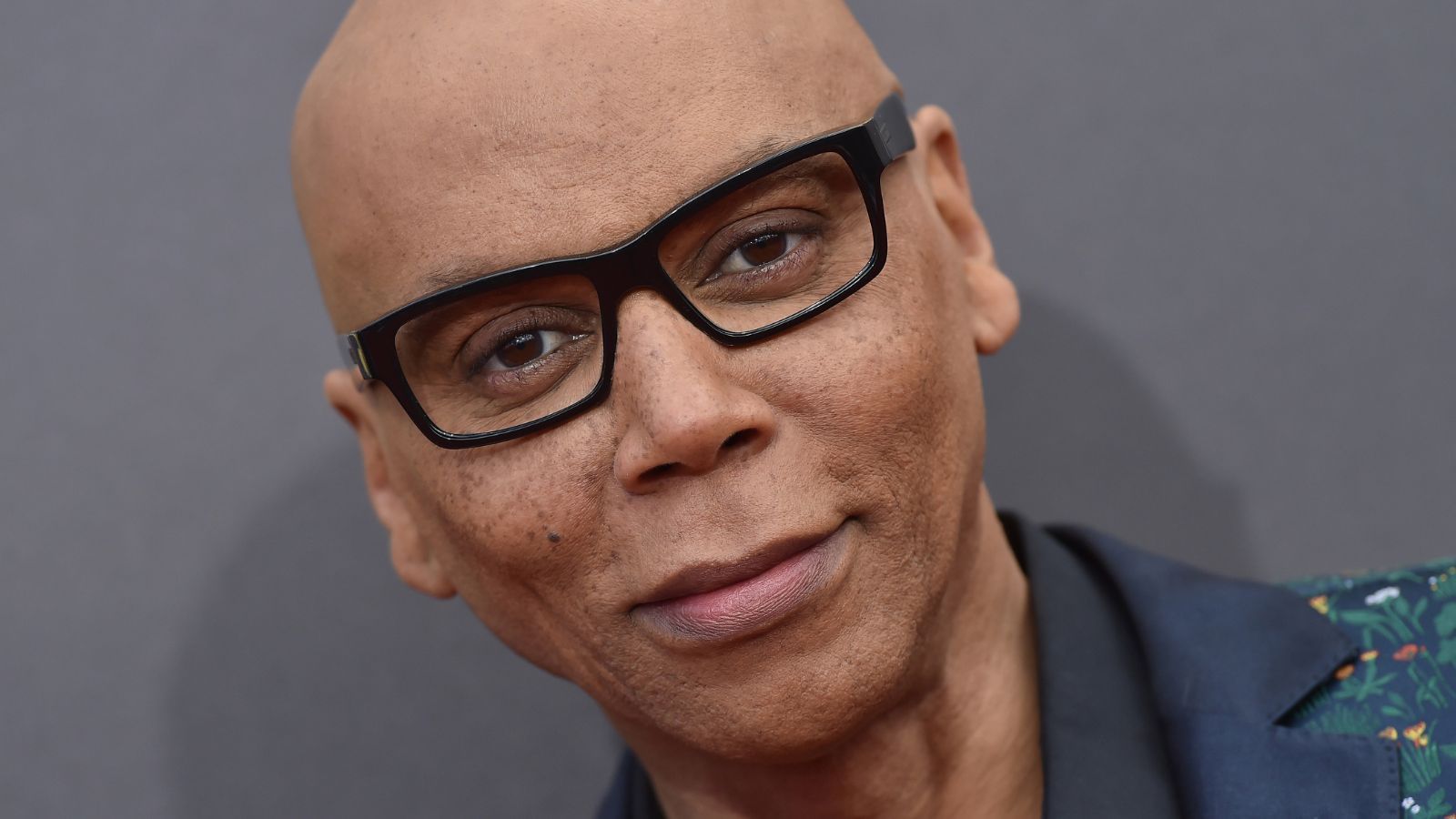 rupaul charles on a gray background