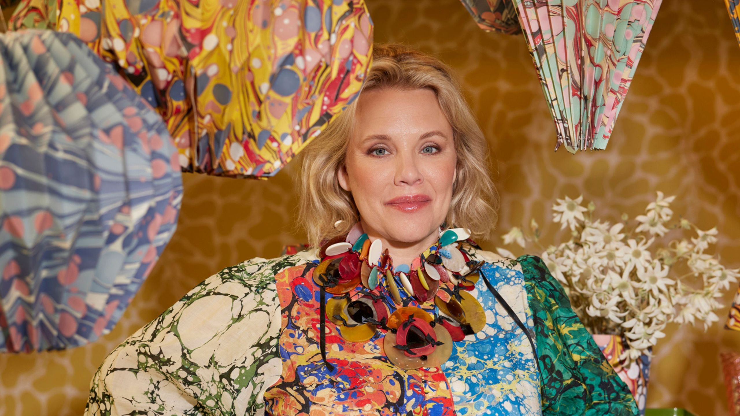 Rebecca Gardner with oversized paper decorations