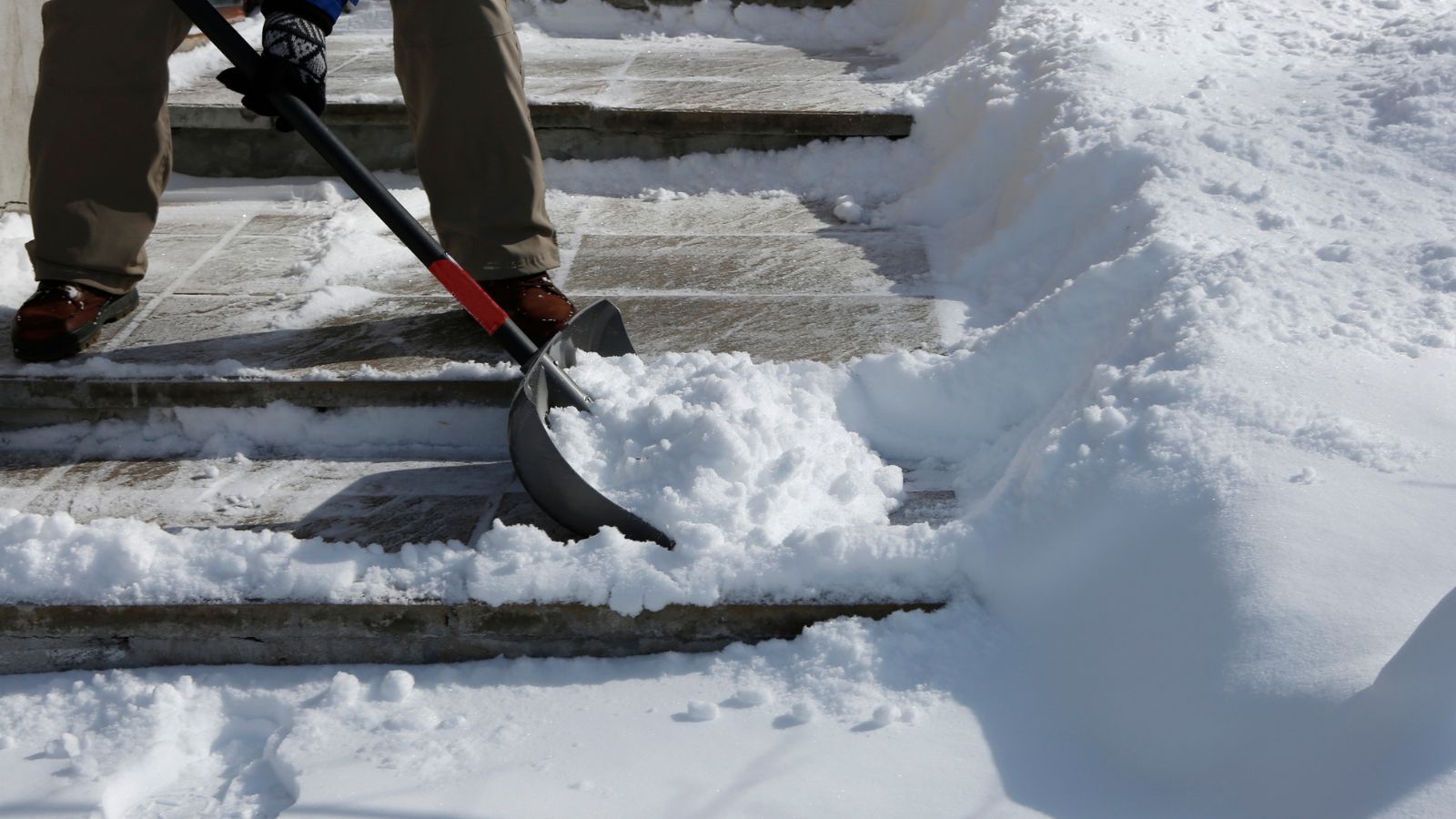 Shovelling snow from steps