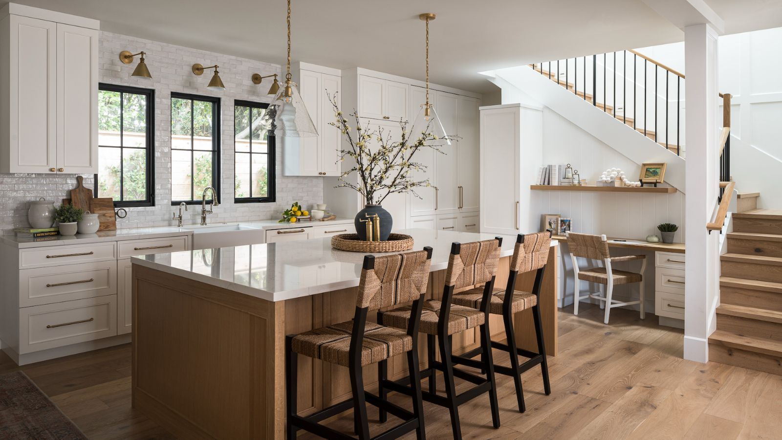 A white kitchen with a wooden island