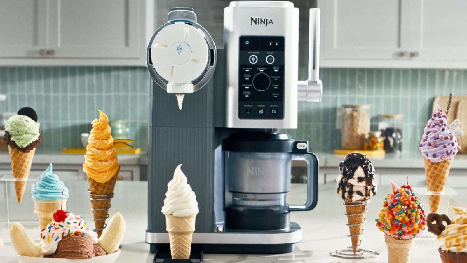 A Ninja® CREAMi® Scoop &amp; Swirl on a kitchen counter surrounded by swirled ice cream in cones.