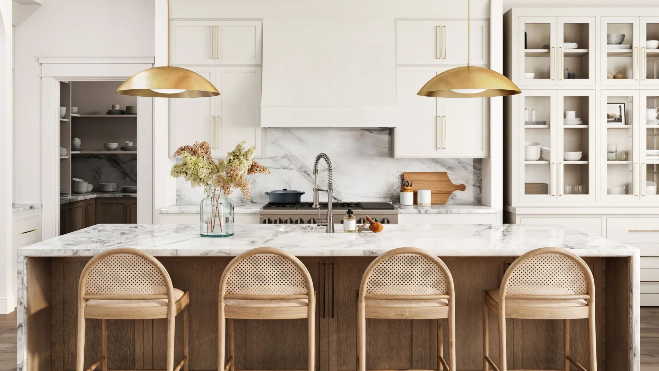 A white kitchen with a wooden island and cane back barstools