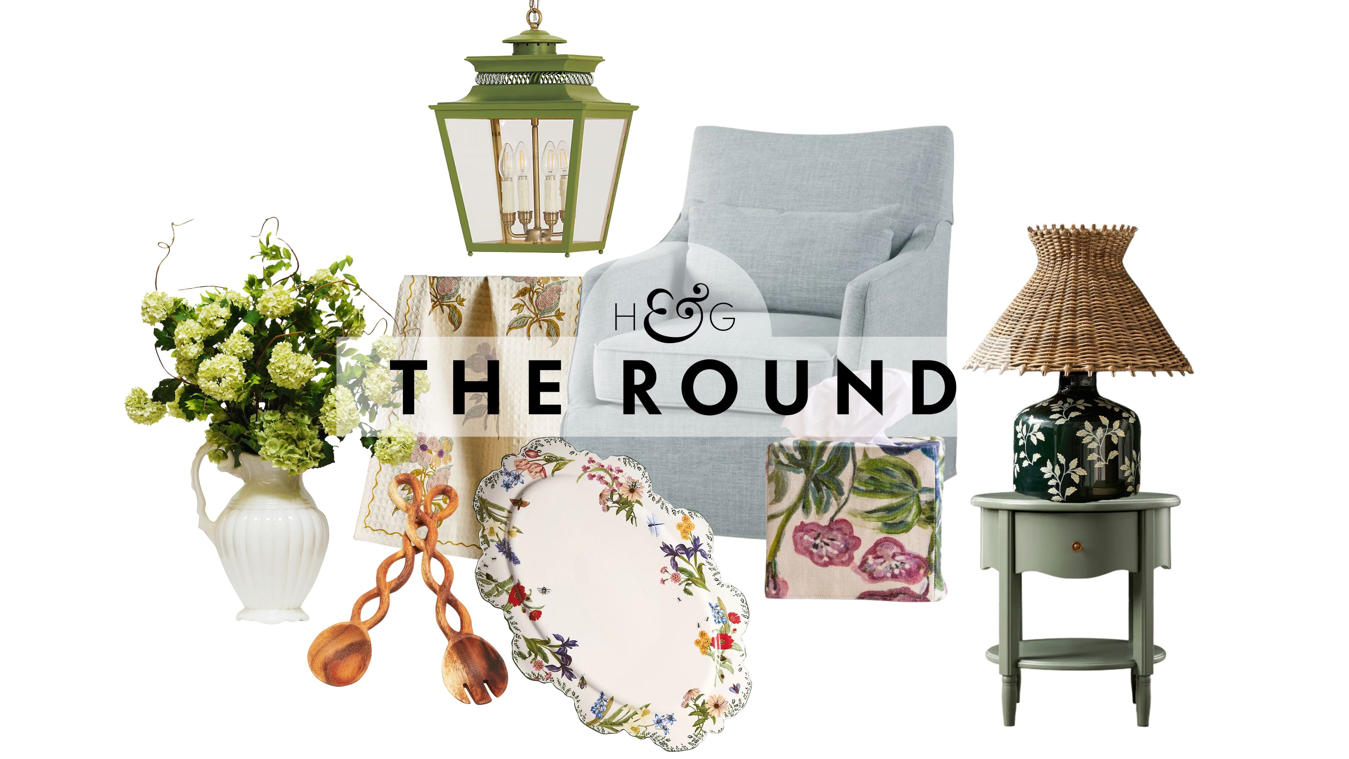 Nancy Meyers Frühlingsdekoration, darunter eine Vase mit Hortensien, ein Satz gedrehter Salatbesteck aus Holz, eine grüne Laternen-Pendelleuchte, ein Tablett mit Blumenrand und ein Akzentstuhl mit Schonbezug, abgebildet vor einem weißen Hintergrund.