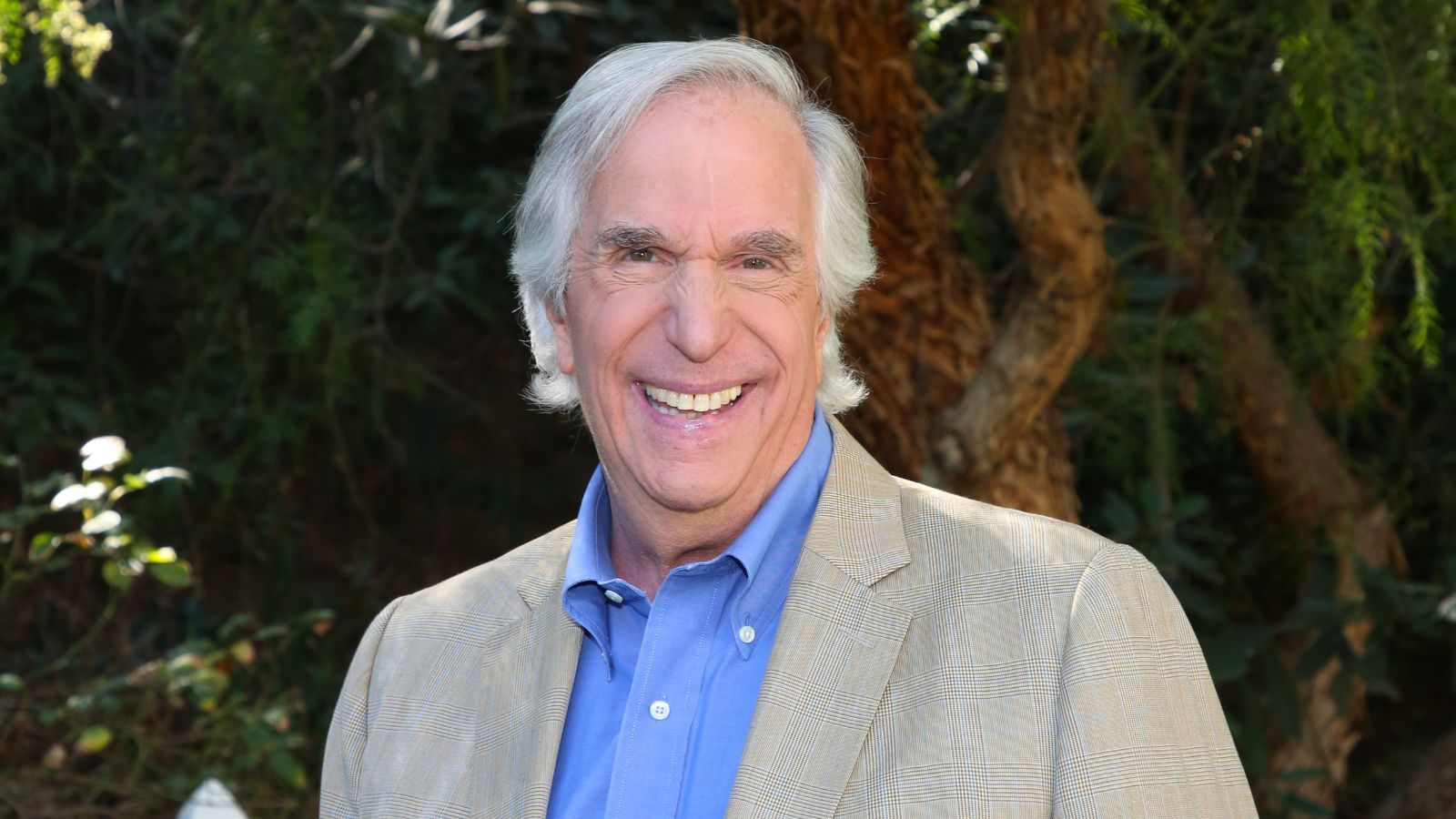 henry winkler on a background of trees