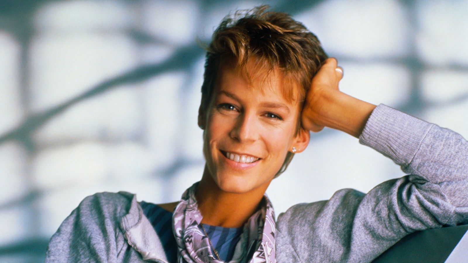 jamie lee curtis on a blue background