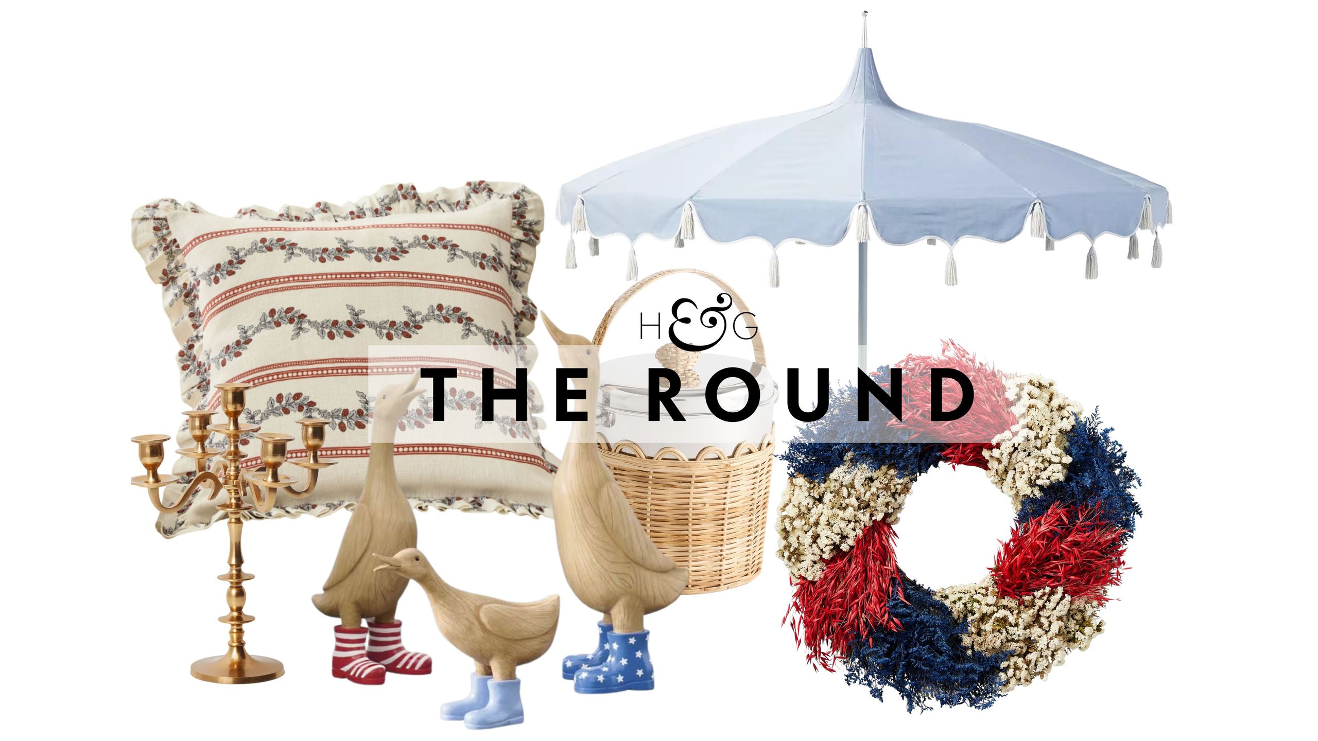 Chic Fourth of July decor, including a gold candelabra, antique-style cushion cover, set of three patriotic geese, woven ice bucket, tassel outdoor umbrella, and red-white-and-blue festive wreath