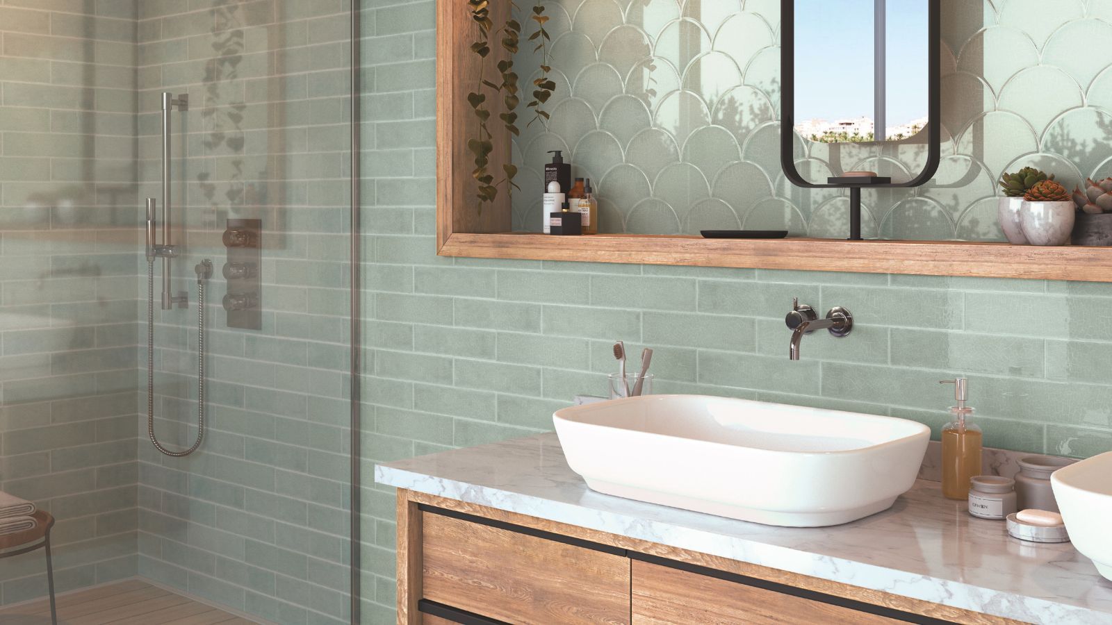 A bathroom with wooden units and light green subway tile walls.