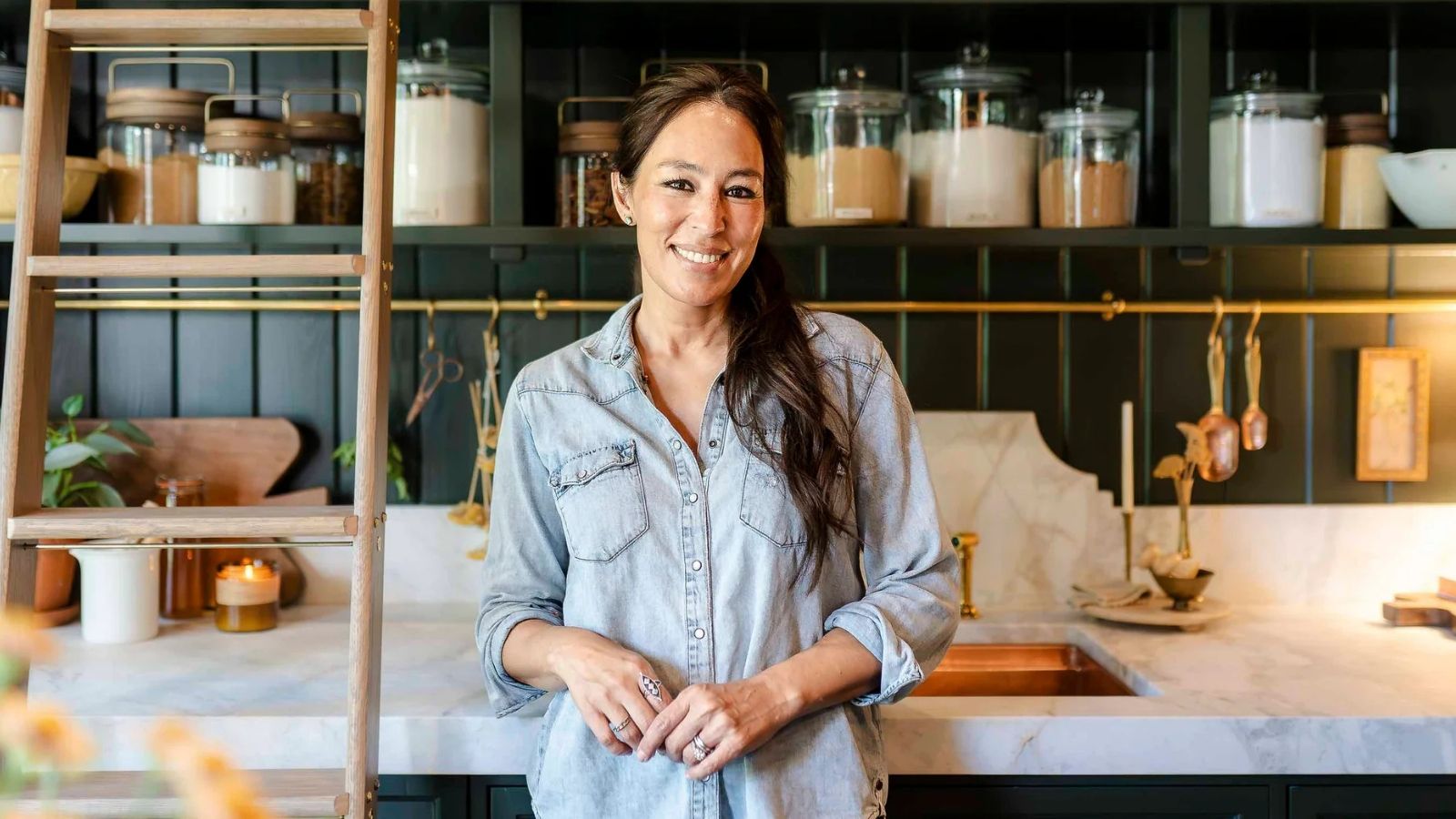 Joanna Gaines in her green kitchen