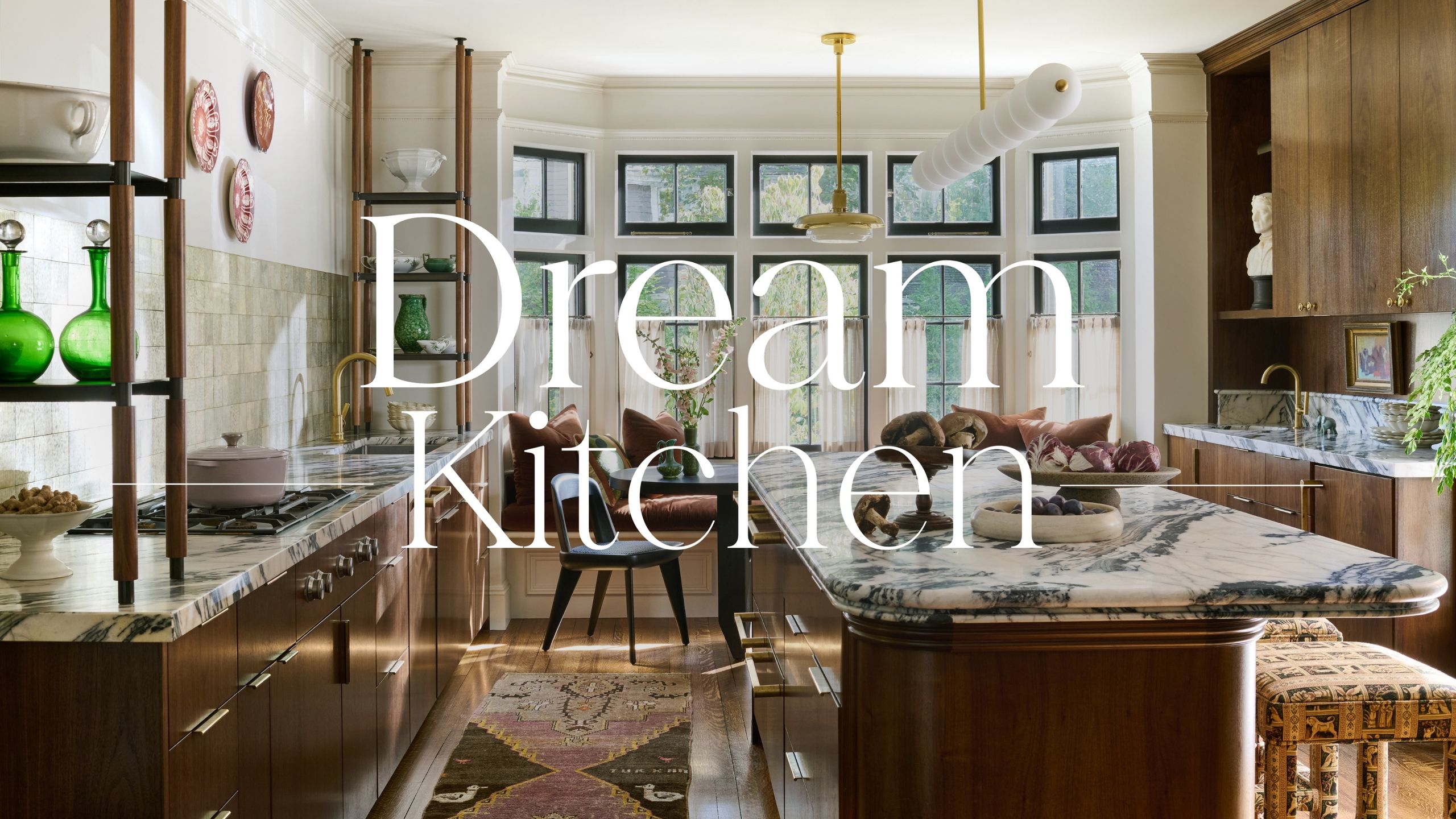 a dark wood and marble kitchen with a Dream Kitchens overlay